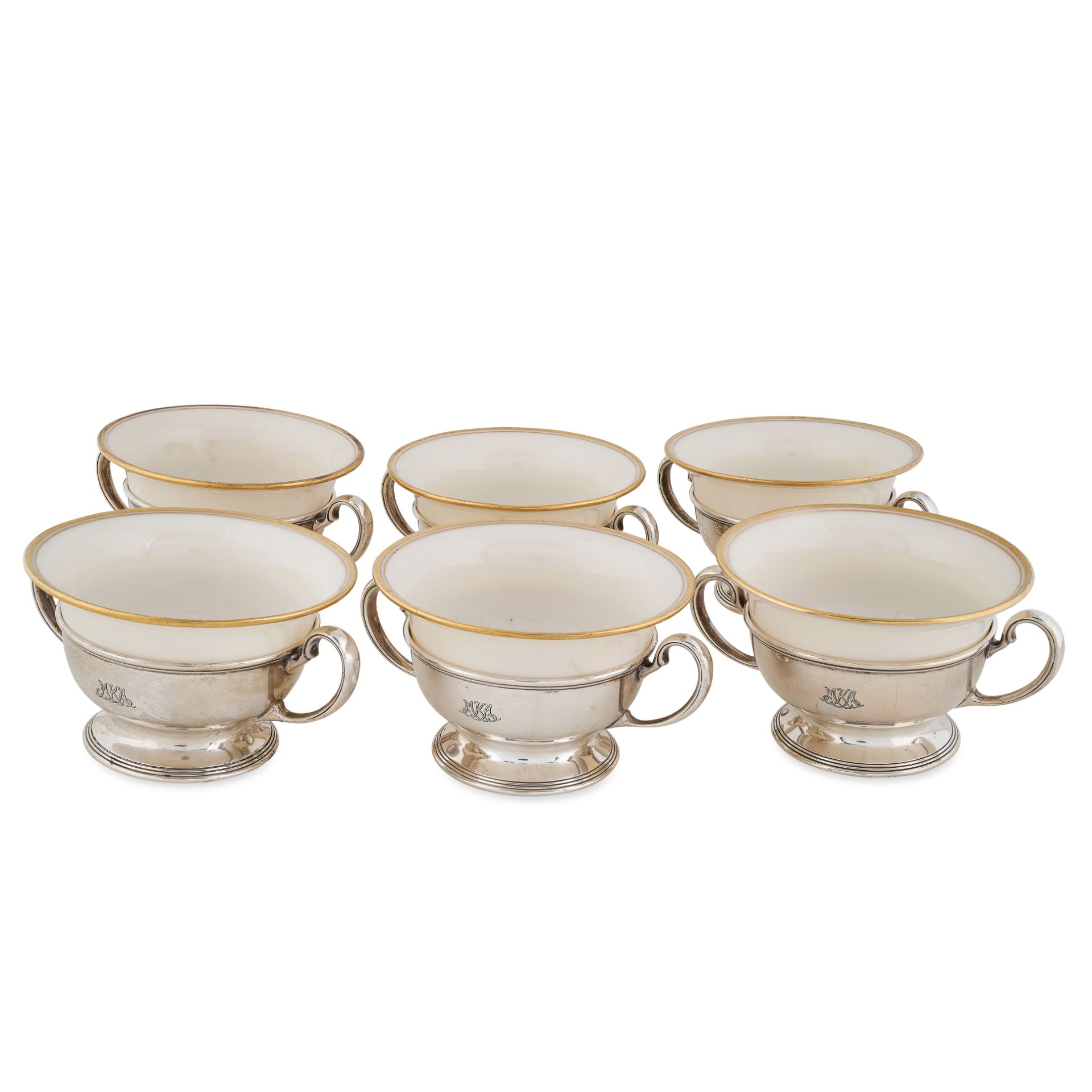 TIFFANY & CO., A SET OF SIX SILVER SOUP BOWLS with porcelain liners, each two handled bowl with a...