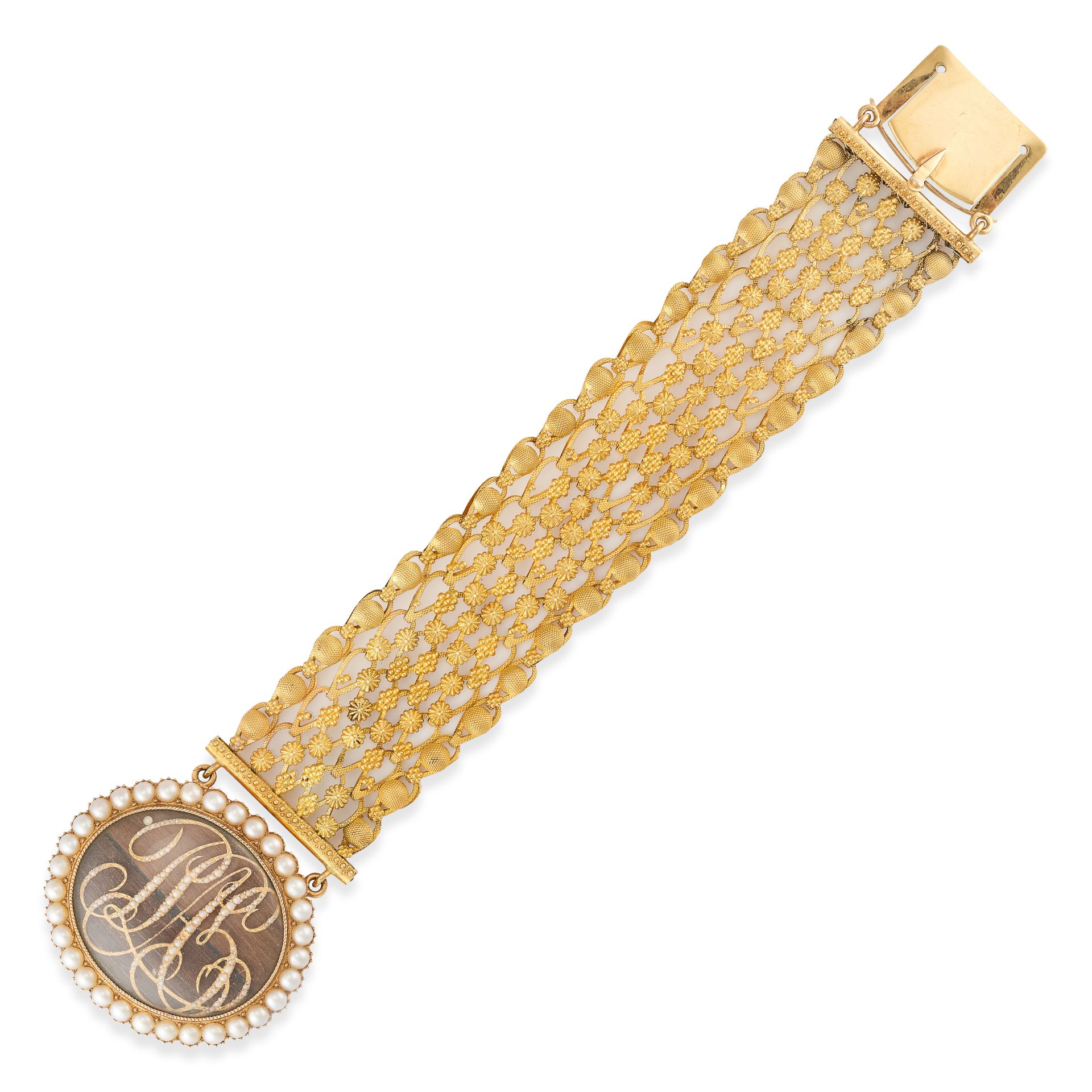 AN ANTIQUE FRENCH HAIRWORK AND PEARL MOURNING BRACELET, 19TH CENTURY in yellow gold, the oval cla...