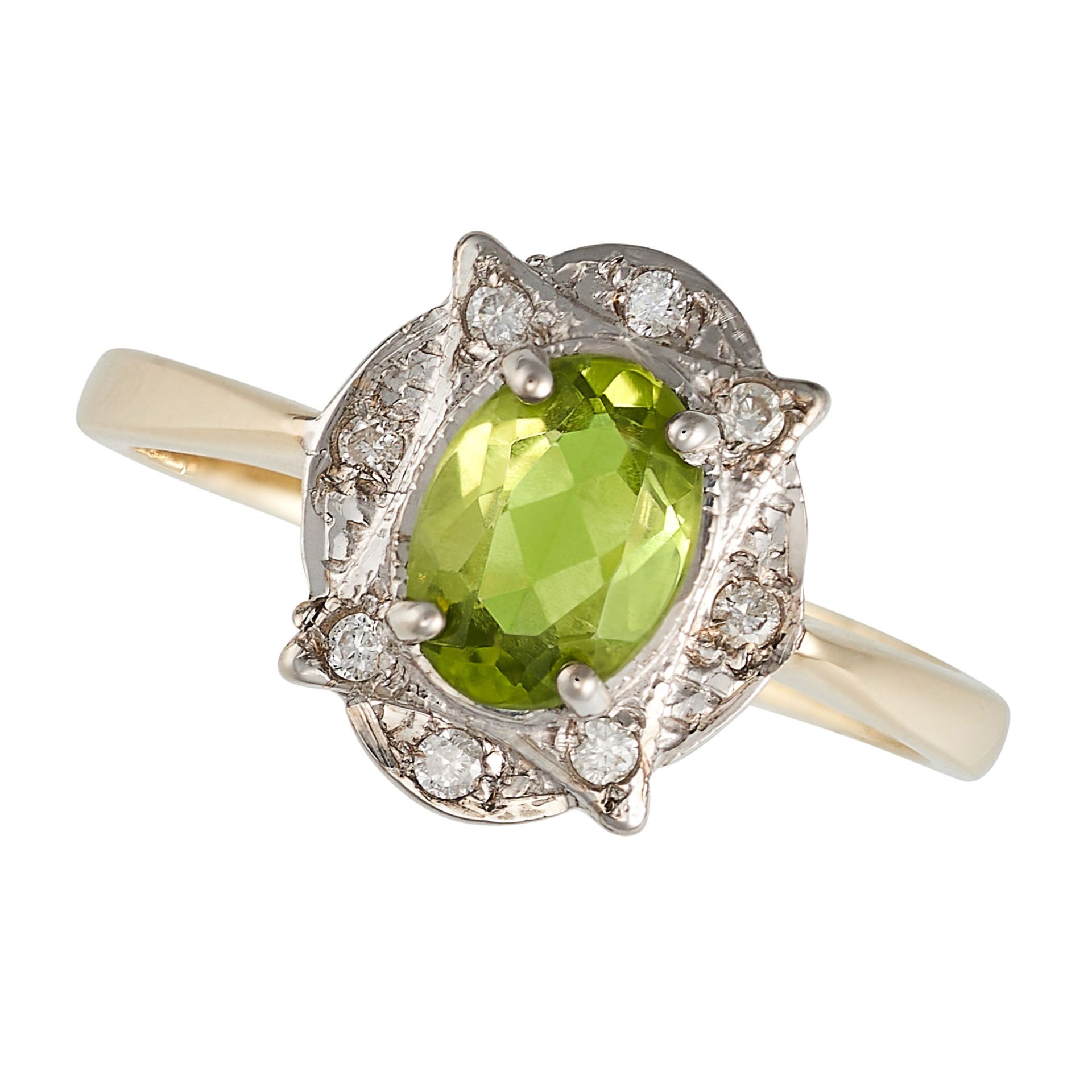 A PERIDOT AND DIAMOND RING in 9ct yellow and white gold, set with an oval cut peridot to a stylis...