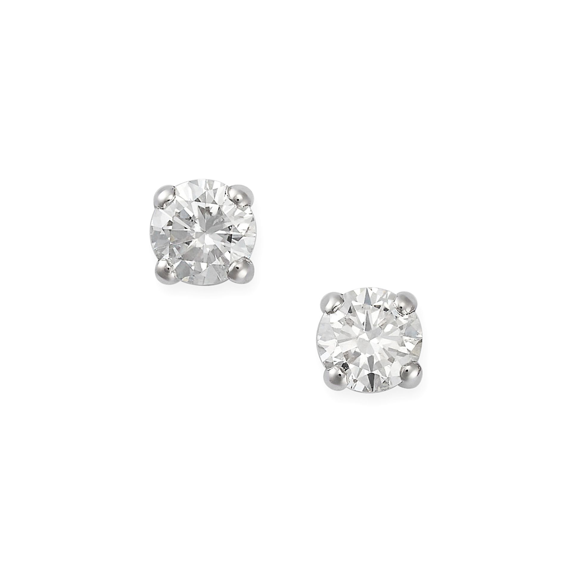 A PAIR OF DIAMOND STUD EARRINGS in 18ct white gold, each set with a round brilliant cut diamond, ...