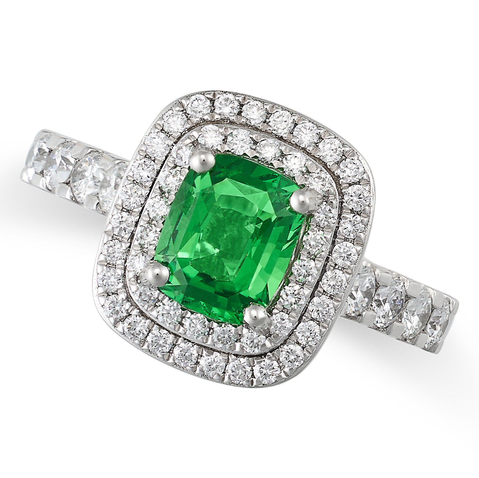 A TSAVORITE GARNET AND DIAMOND CLUSTER RING in platinum, set with a cushion cut tsavorite garnet