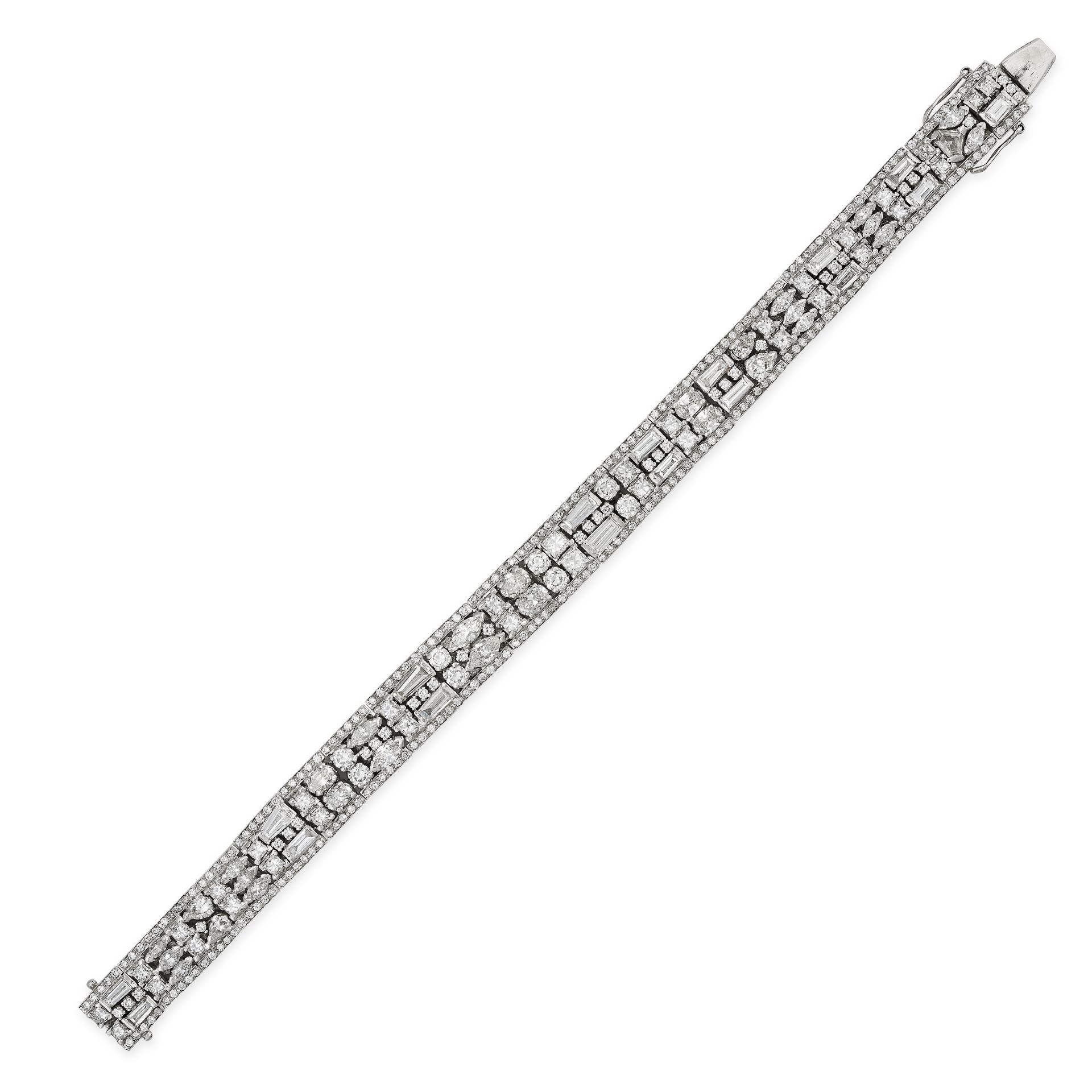 A DIAMOND BRACELET in 18ct white gold, set with two rows of tapered baguette, marquise, princess,