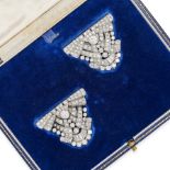 AN ANTIQUE ART DECO DIAMOND DOUBLE CLIP BROOCH in scrolling geometric design, set throughout with