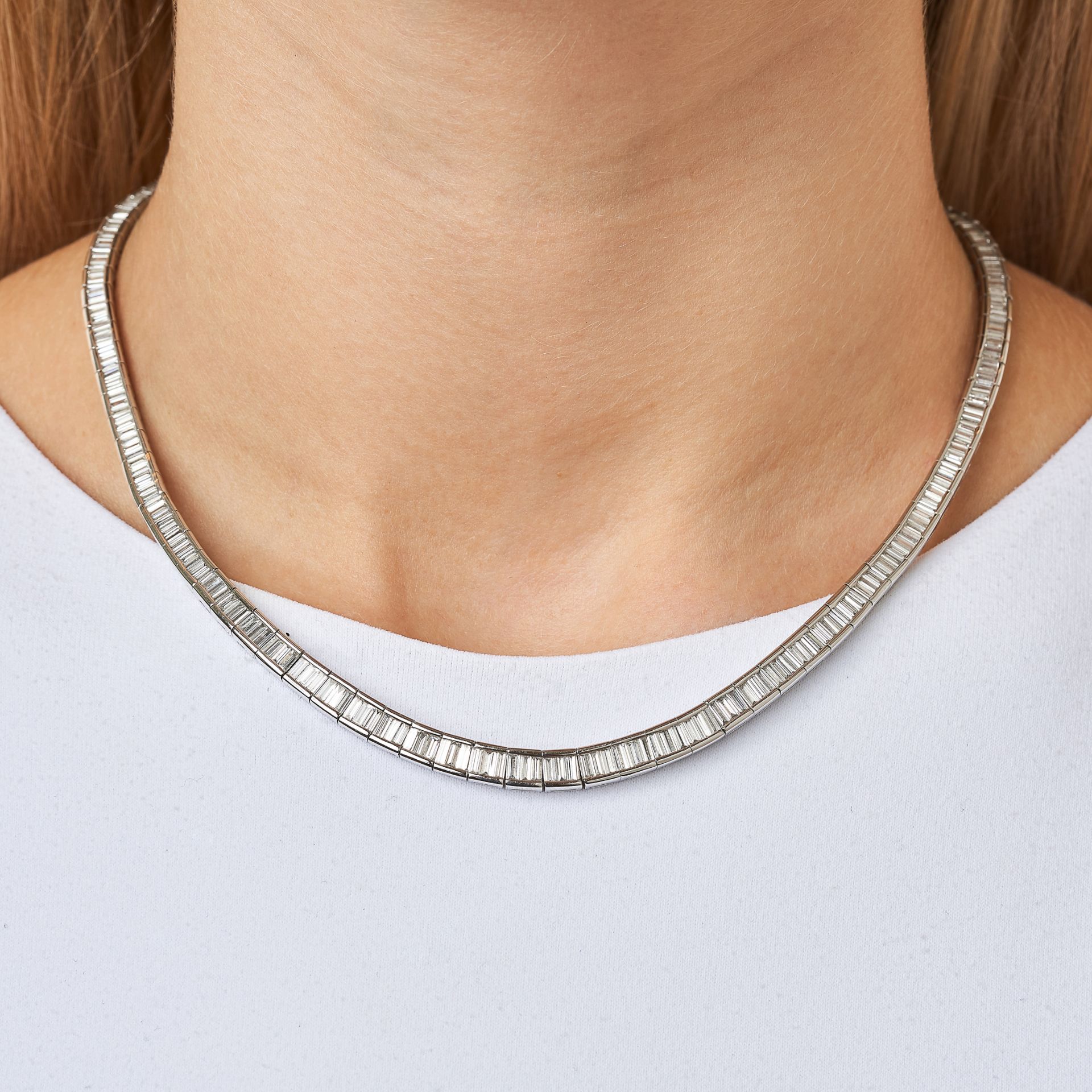 A FINE DIAMOND LINE NECKLACE in platinum, set with a row of graduated baguette cut diamonds all - Image 2 of 2