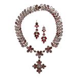 AN ANTIQUE GARNET NECKLACE AND EARRINGS SUITE, 19TH CENTURY in yellow gold, the riviere necklace set