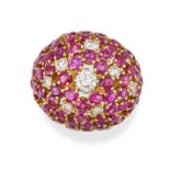 A RUBY AND DIAMOND BOMBE RING in yellow gold, the bombe face set with round cut rubies and round