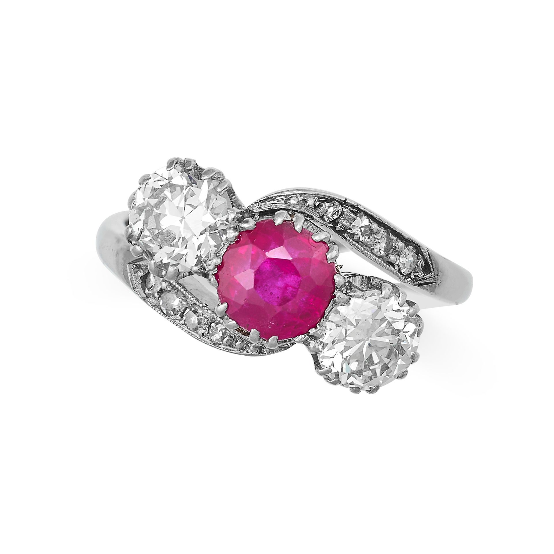 A RUBY AND DIAMOND THREE STONE RING in platinum and 18ct white gold, set with a round cut ruby of