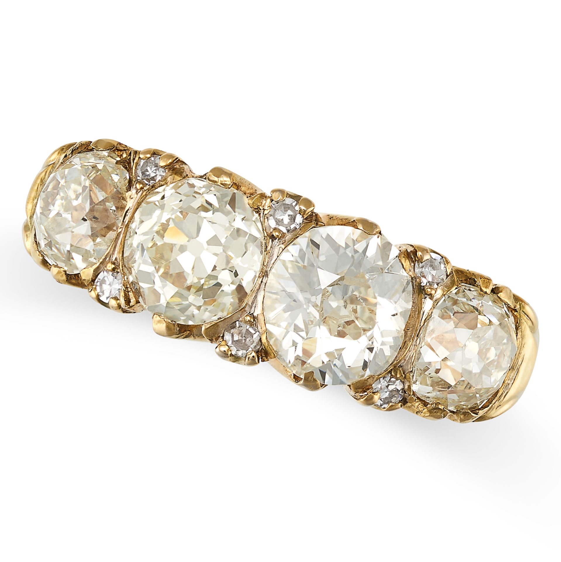 A DIAMOND HALF HOOP RING in yellow gold, set with four principal old cut diamonds of approximately