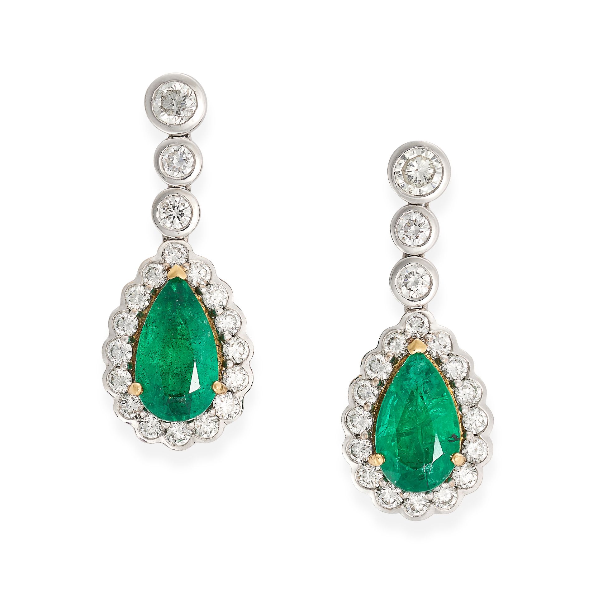 A PAIR OF EMERALD AND DIAMOND DROP EARRINGS in 18ct white gold, each comprising a row of round