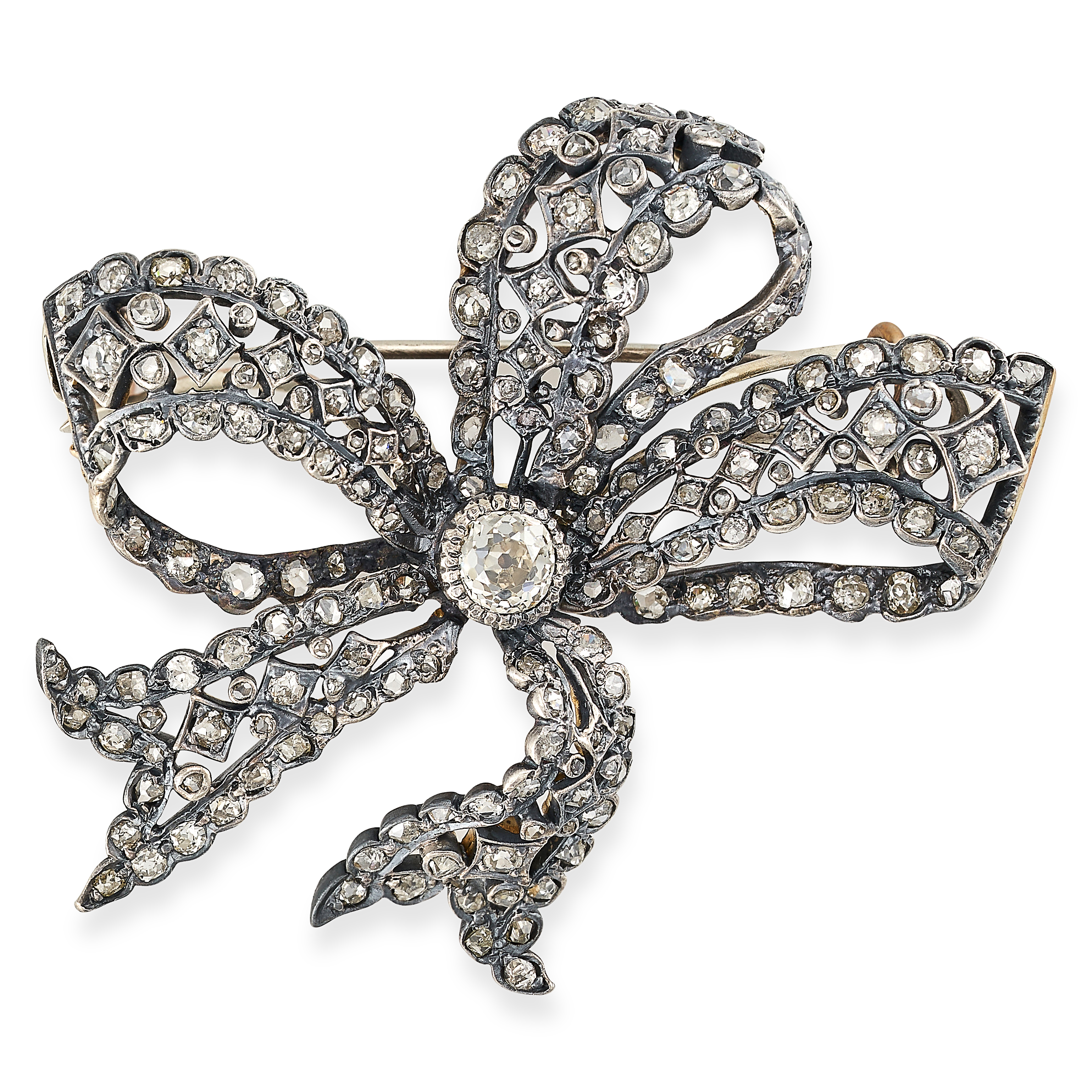 AN ANTIQUE DIAMOND BOW BROOCH in yellow gold and silver, designed as a ribbon tied into a bow, set
