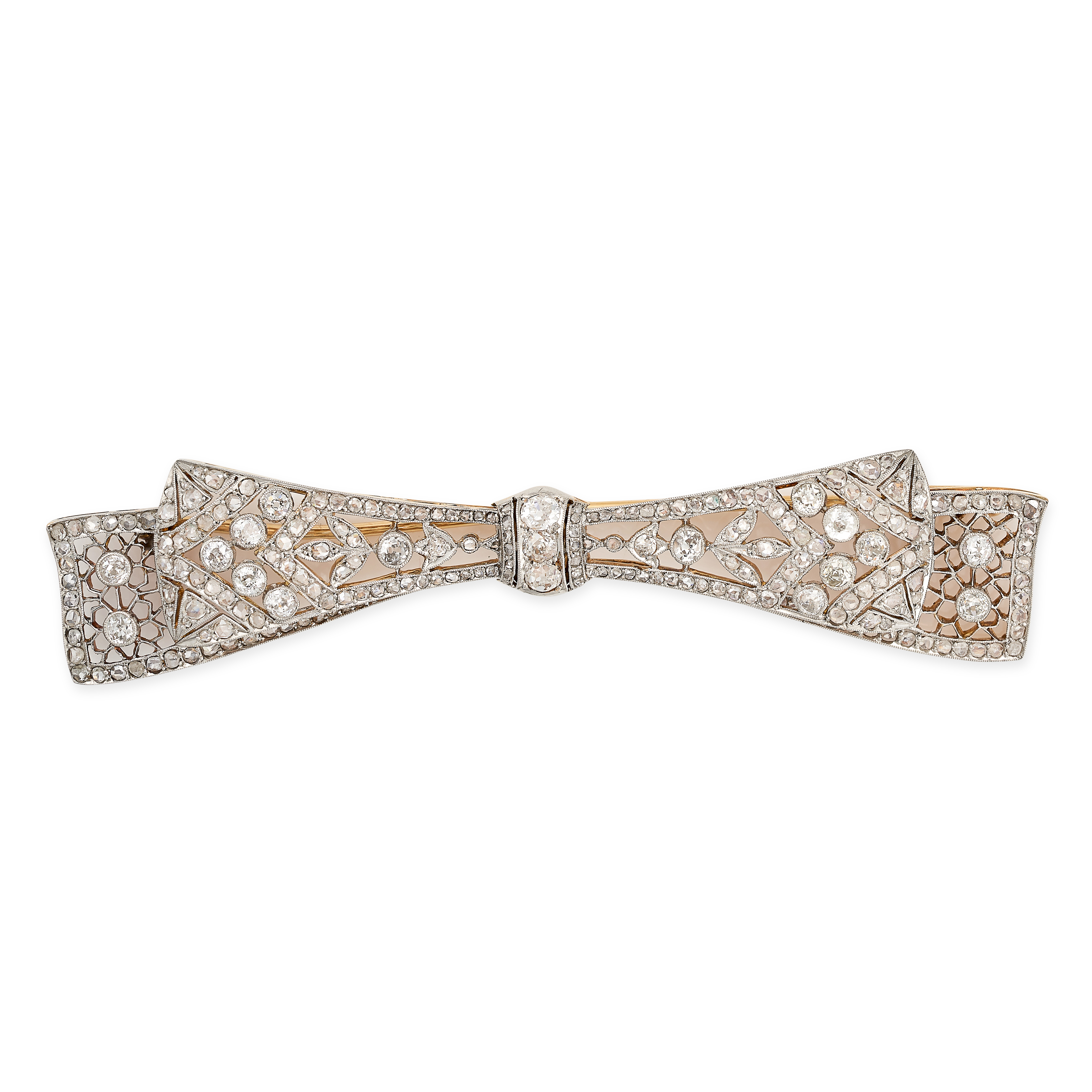 AN ANTIQUE EDWARDIAN DIAMOND BOW BROOCH in yellow gold, designed as a ribbon tied into a bow, the