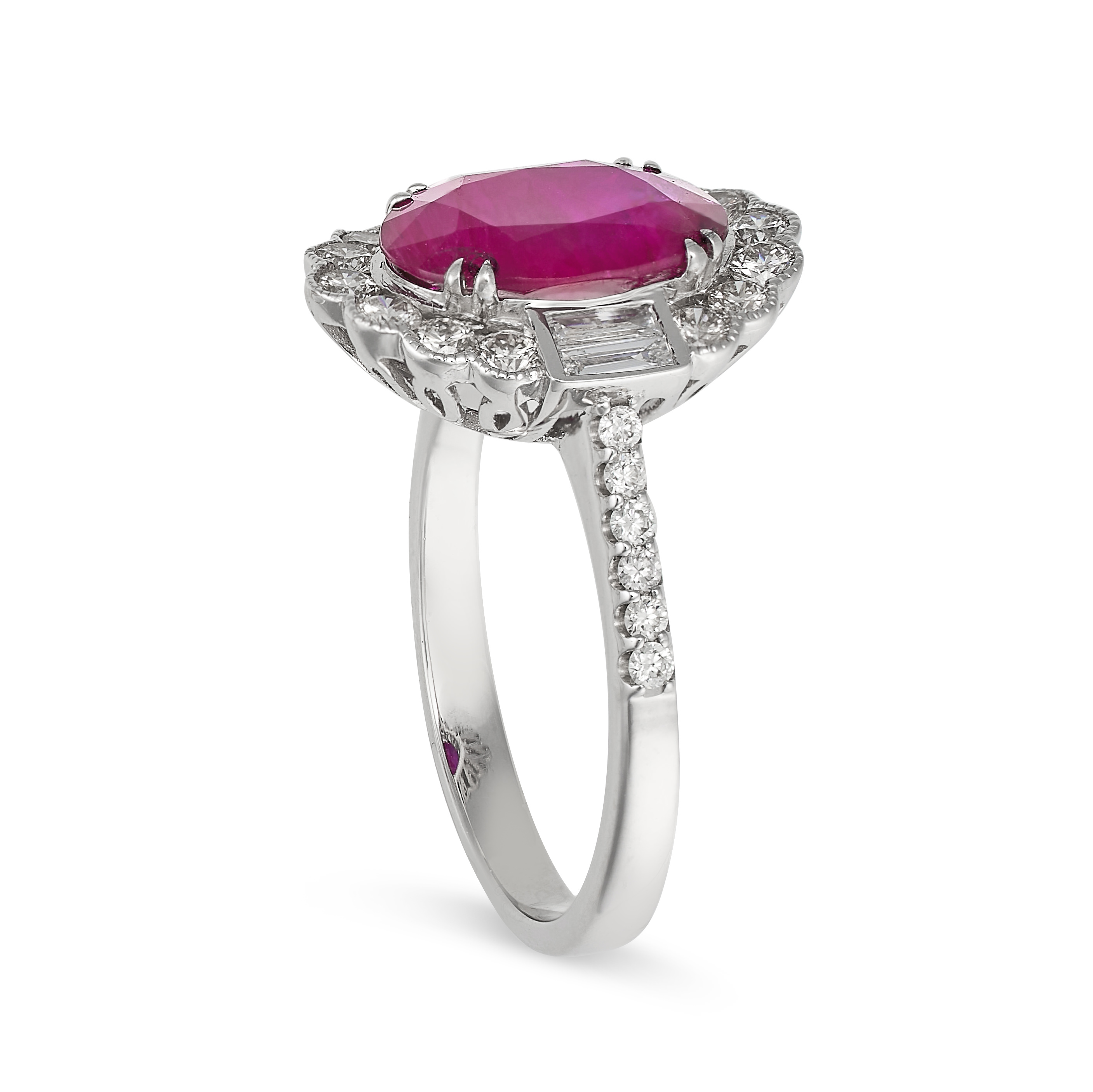 A RUBY AND DIAMOND CLUSTER RING in 18ct white gold, set with an oval cut ruby of 2.49 carats in a - Image 2 of 2