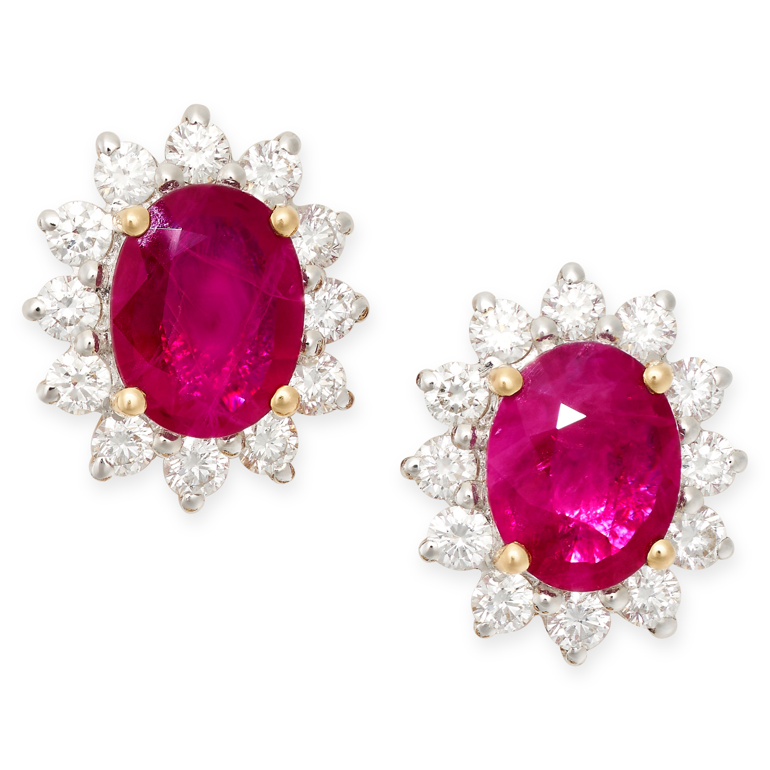 A PAIR OF RUBY AND DIAMOND CLUSTER STUD EARRINGS in 18ct yellow gold, each set with an oval cut ruby