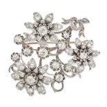 A DIAMOND SPRAY BROOCH in yellow gold and silver, designed as a spray of three flowers, the