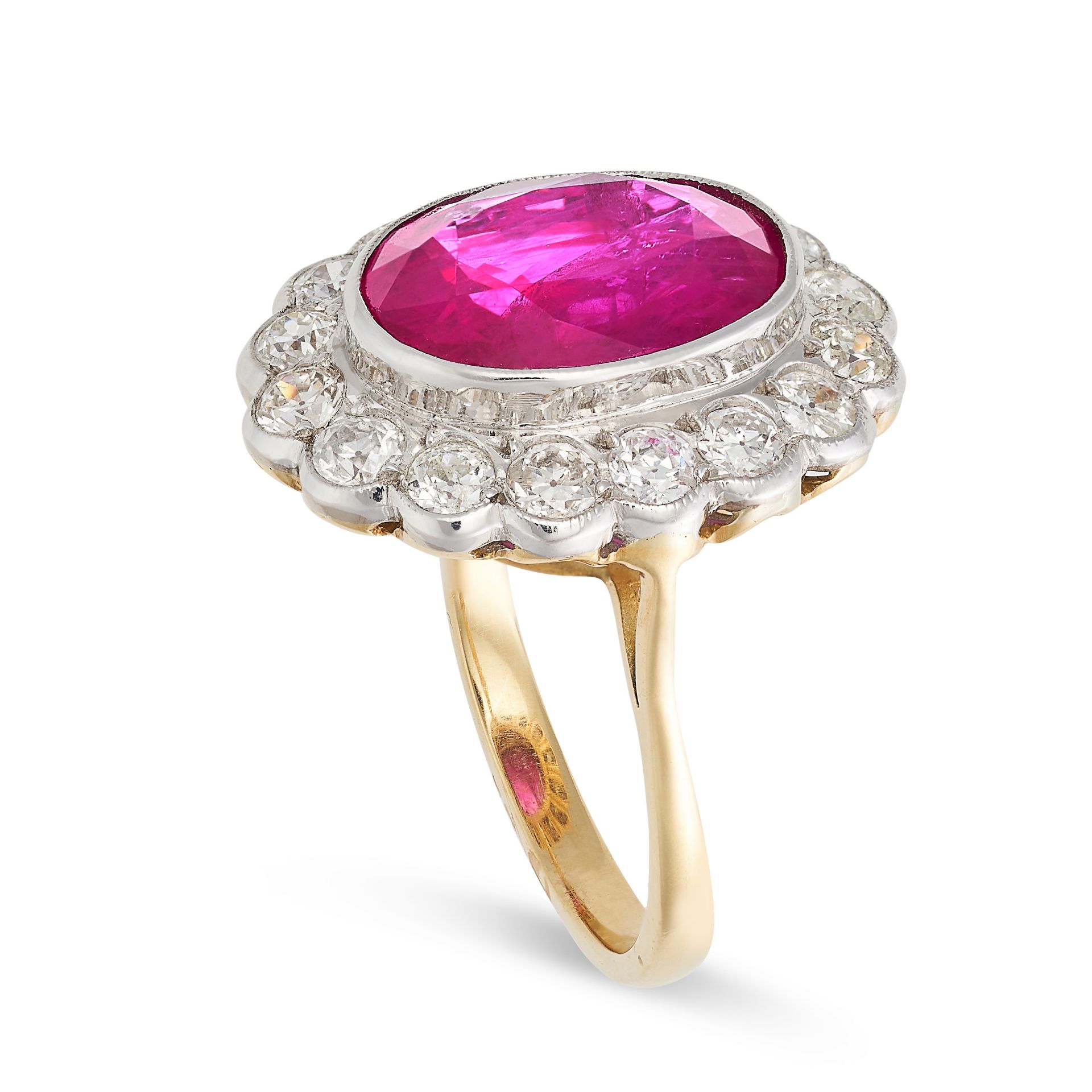A RUBY AND DIAMOND CLUSTER RING in 18ct yellow gold, set with an oval cut ruby of approximately 7.05 - Image 2 of 2
