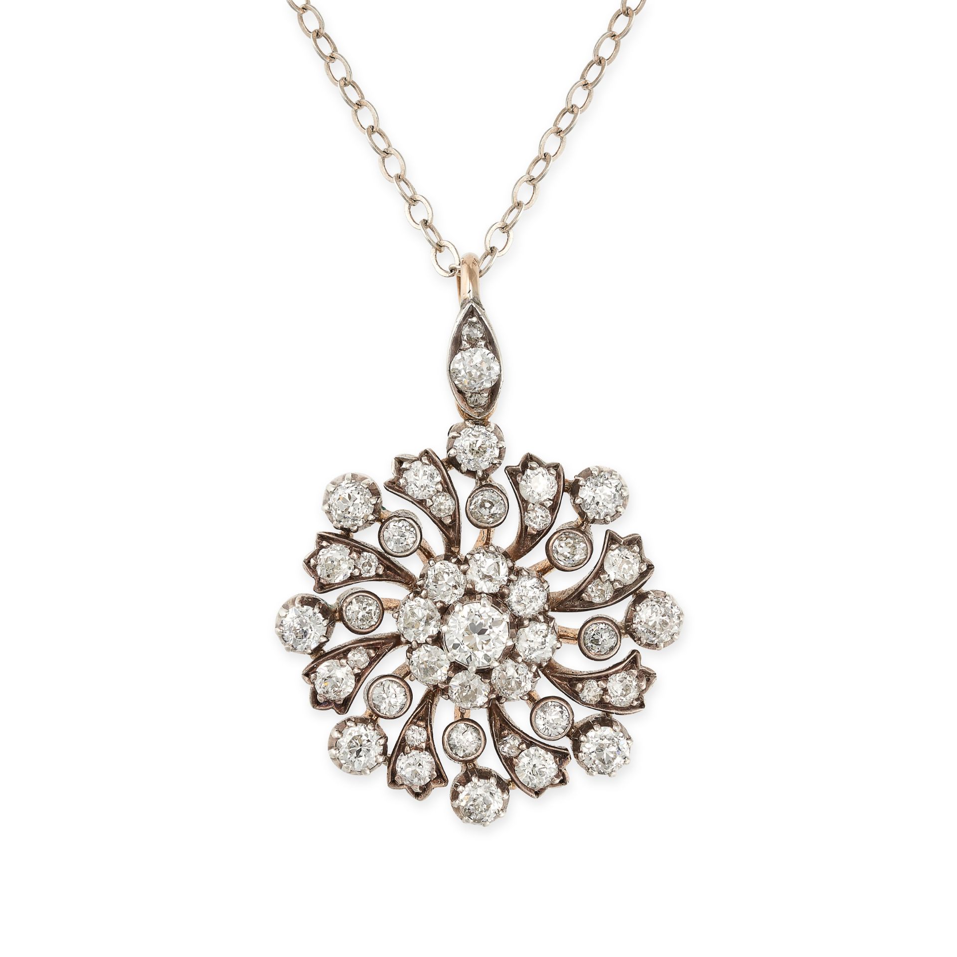 AN ANTIQUE DIAMOND SNOWFLAKE PENDANT AND CHAIN, CIRCA 1900 in yellow gold and silver, the