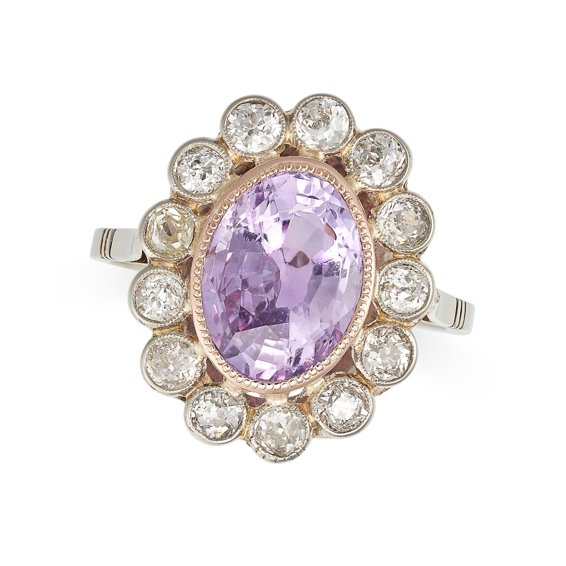 A CEYLON NO HEAT PINK SAPPHIRE AND DIAMOND CLUSTER RING set with an oval cut pink sapphire of 5.62