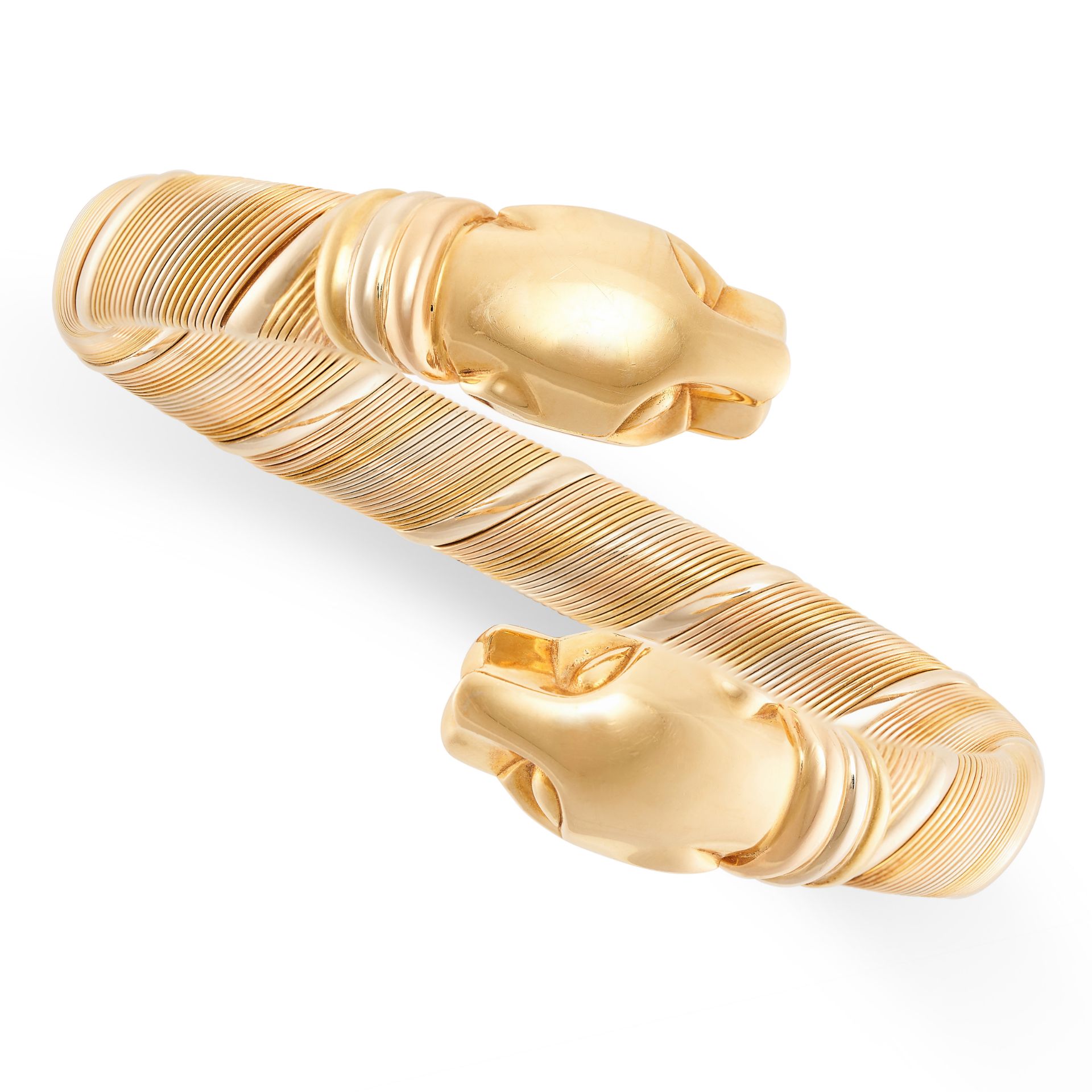 CARTIER, A VINTAGE PANTHERE DE CARTIER BANGLE in 18ct yellow, white and rose gold, the flexible body - Image 2 of 3