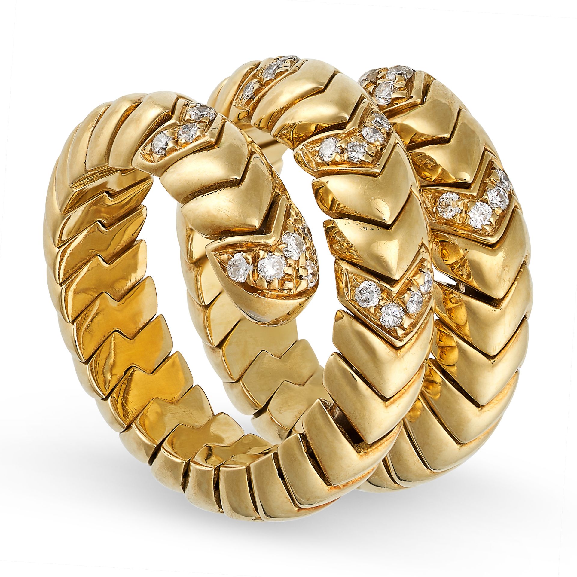 A DIAMOND DRESS RING in 18ct yellow gold and steel, the coiled snake-like body formed of articulated