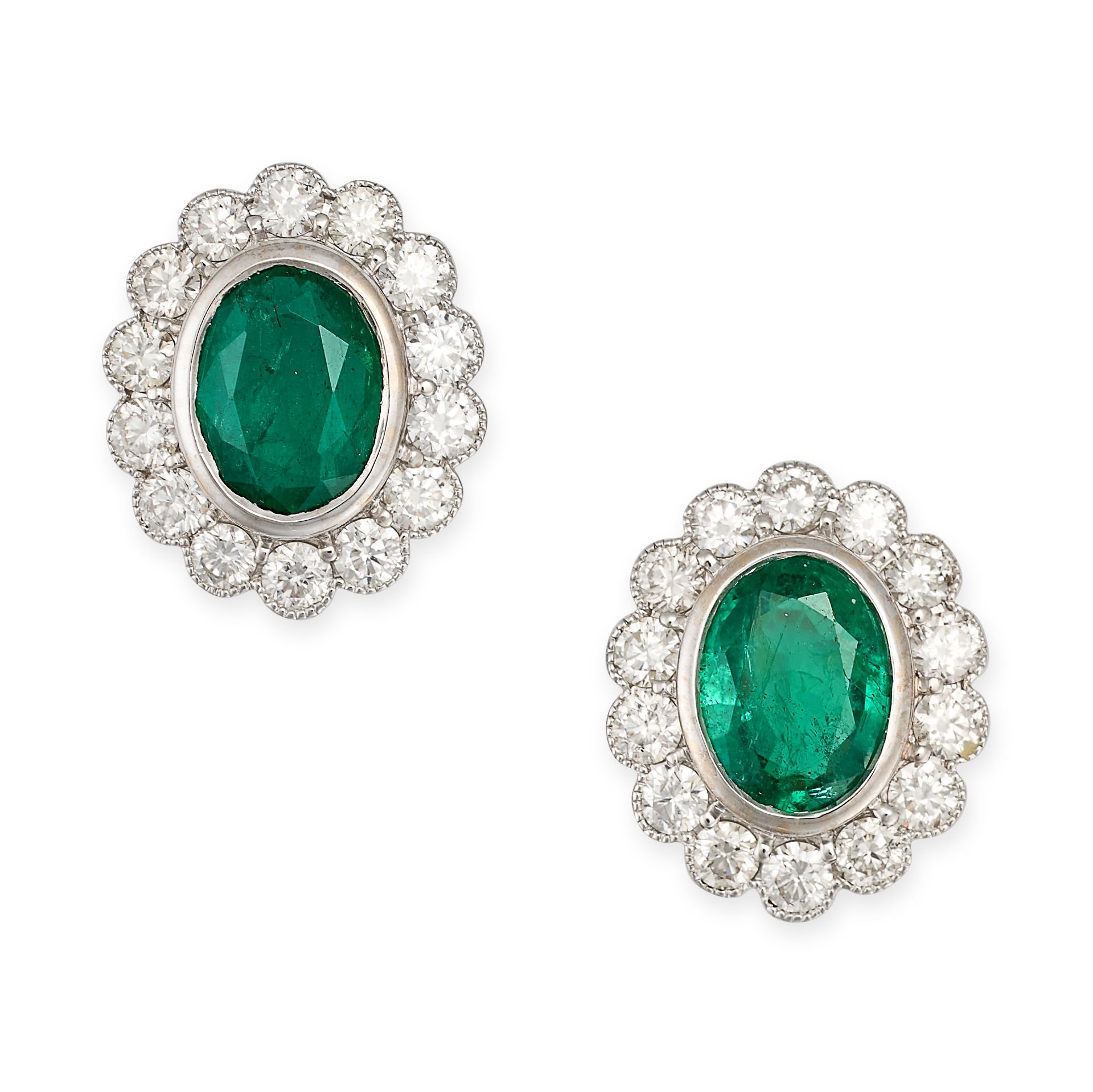 A PAIR OF EMERALD AND DIAMOND CLUSTER EARRINGS in 18ct white gold, each set with an oval cut emerald