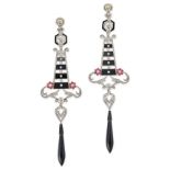 AN EXCEPTIONAL PAIR OF DIAMOND, ONYX, ENAMEL AND RUBY DROP EARRINGS in platinum, each set with an