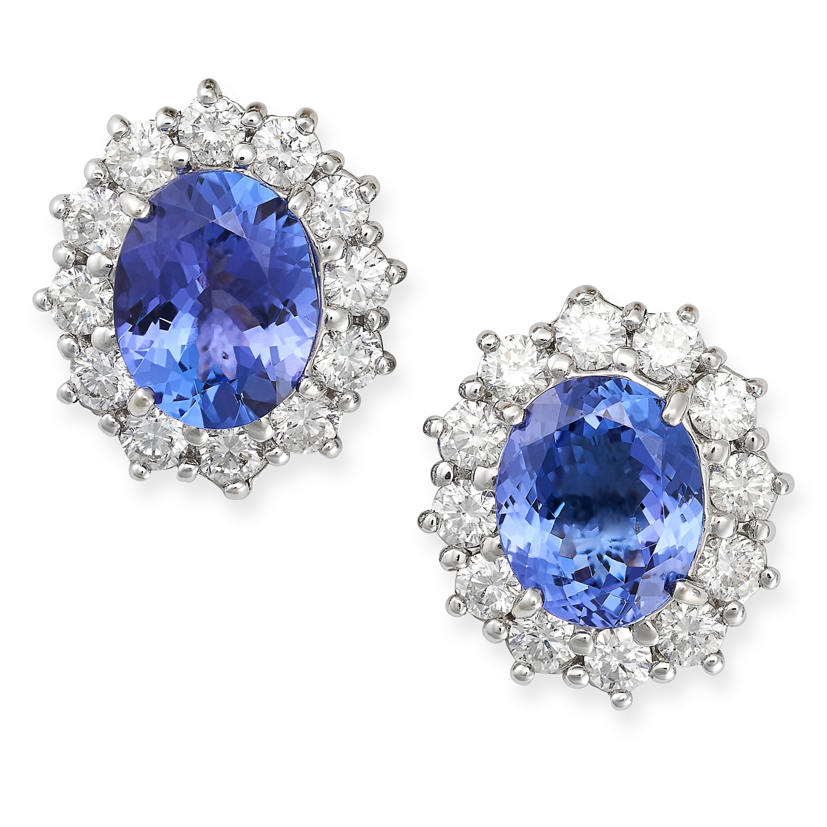 A PAIR OF TANZANITE AND DIAMOND CLUSTER EARRINGS in 18ct white gold, each set with an oval cut ta...