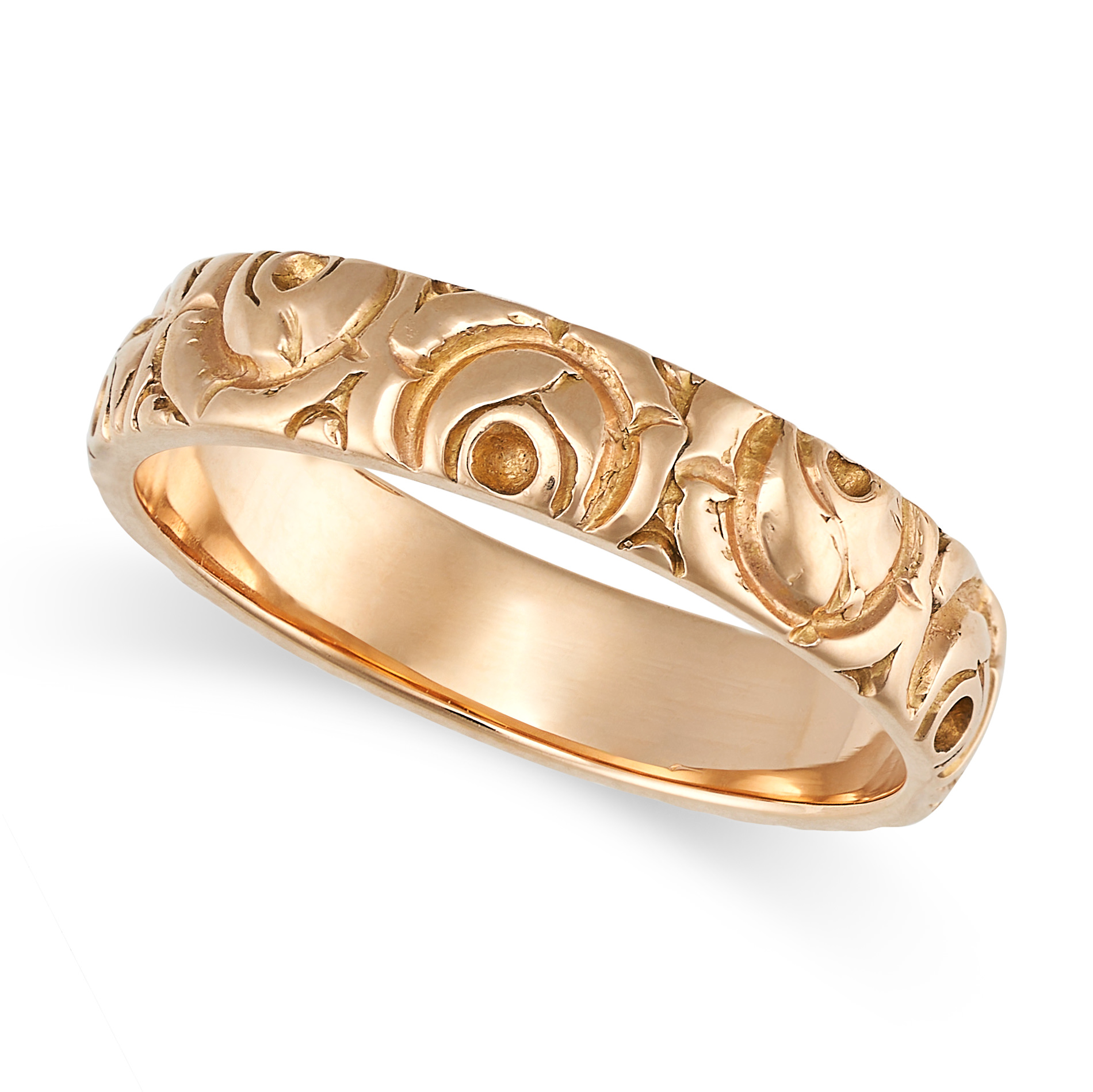 A GOLD BAND RING in yellow gold, with an engraved foliate design, no assay marks, size M / 6.26, ...