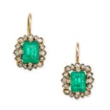 A PAIR OF COLOMBIAN EMERALD AND DIAMOND EARRINGS in yellow gold, each set with a step cut emerald...