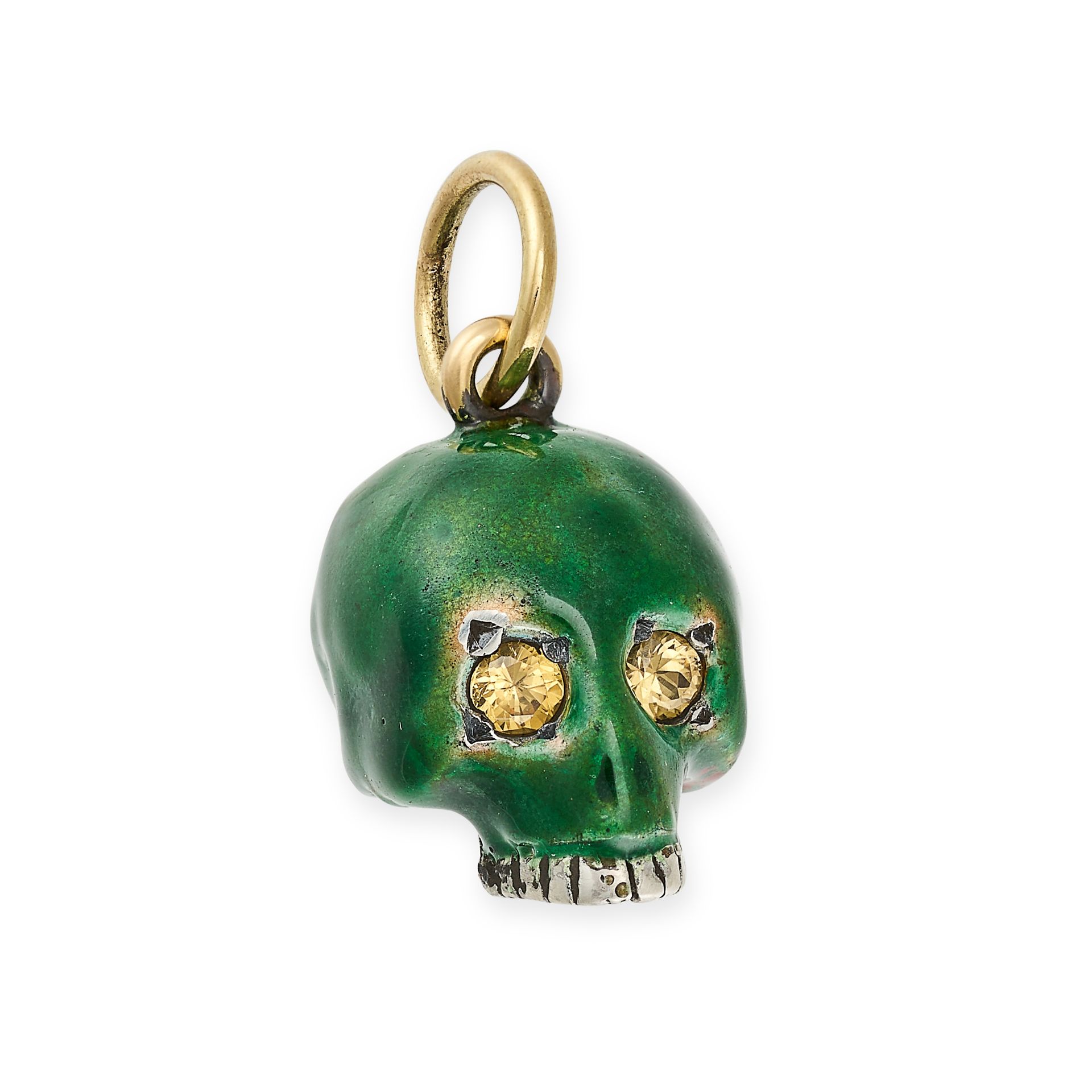 A YELLOW SAPPHIRE AND ENAMEL SKULL CHARM / PENDANT in yellow gold and silver, designed as a skull...