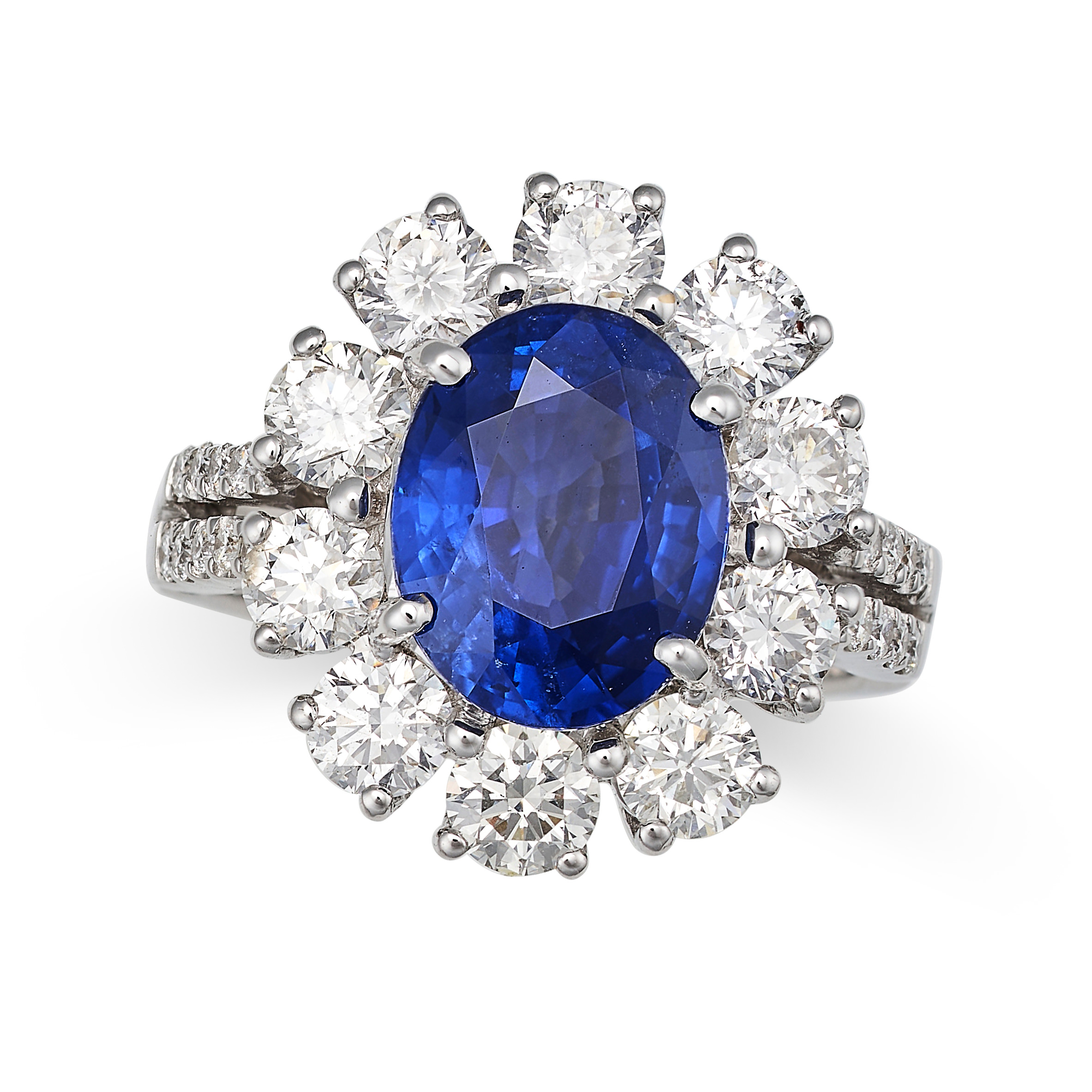 A SAPPHIRE AND DIAMOND CLUSTER RING in 18ct white gold, set with an oval cut sapphire of 4.27 car...
