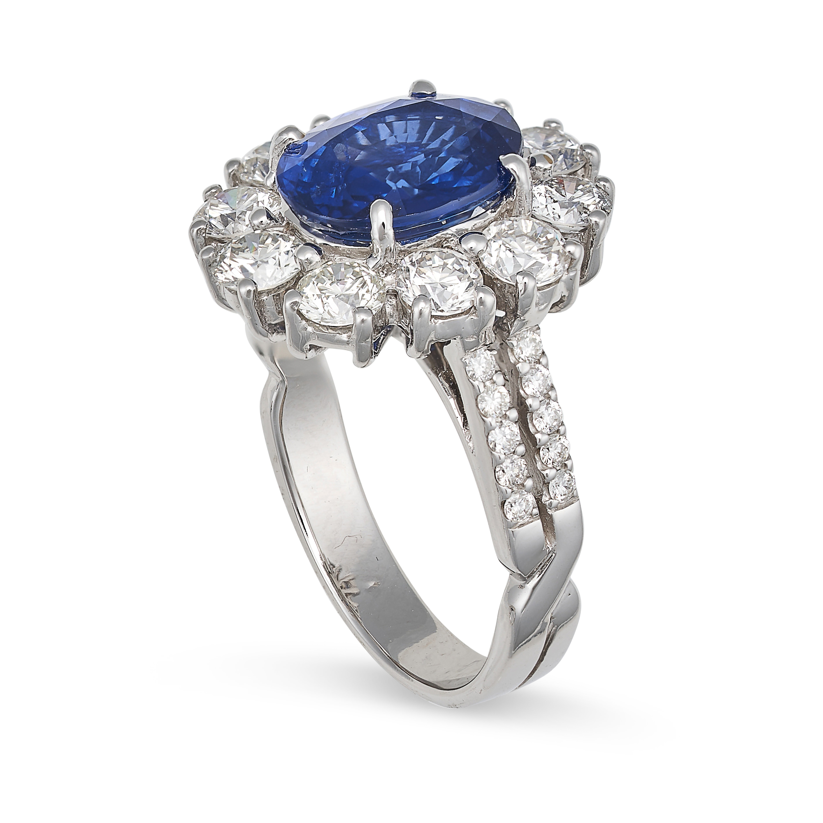 A SAPPHIRE AND DIAMOND CLUSTER RING in 18ct white gold, set with an oval cut sapphire of 4.27 car... - Image 2 of 2