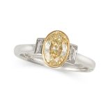 A YELLOW DIAMOND AND WHITE DIAMOND RING set with an oval cut yellow diamond of 1.00 carats betwee...