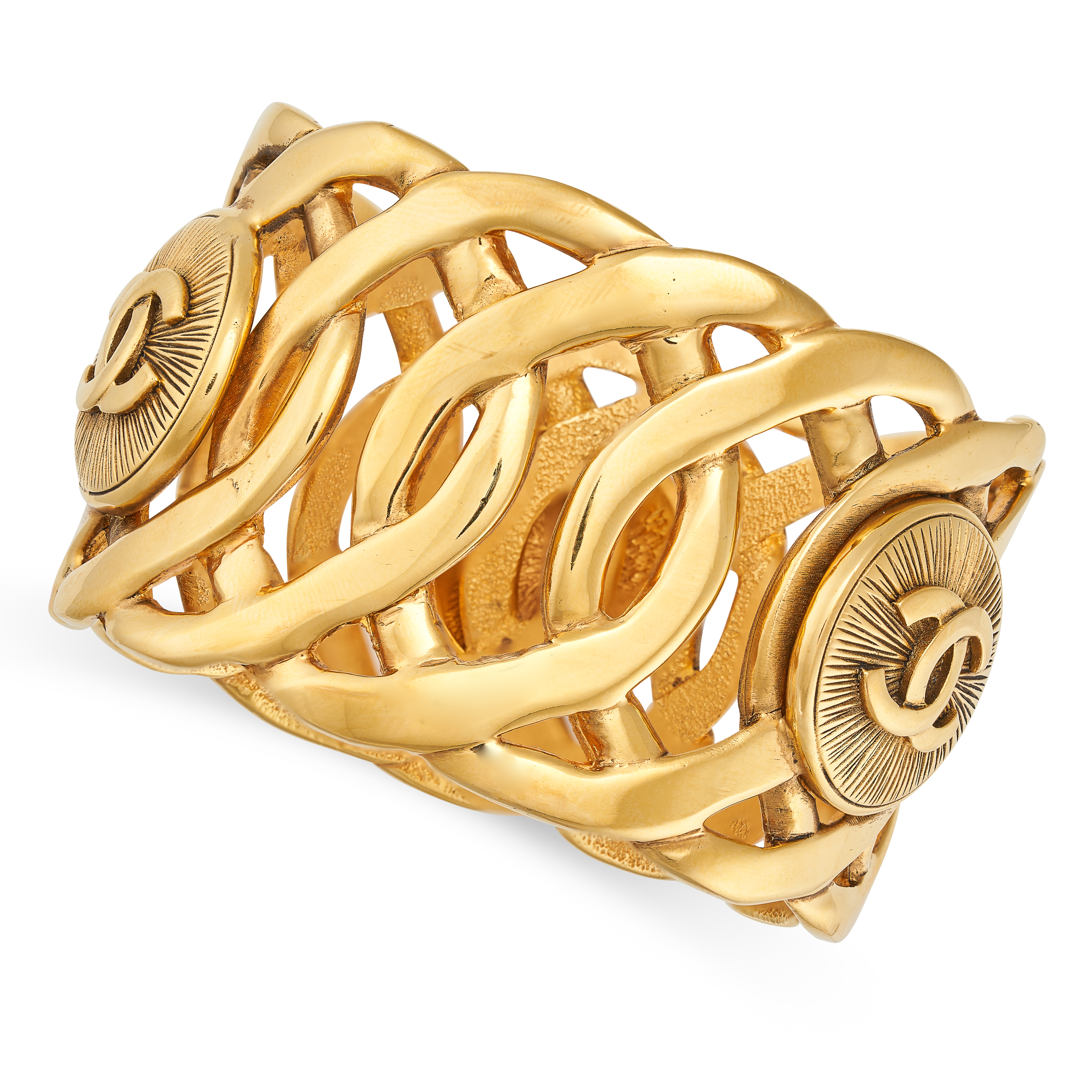 CHANEL, A VINTAGE CC CUFF BANGLE formed of interlocking openwork links with three applied medalli...