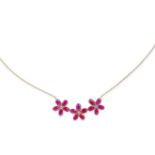 A RUBY AND DIAMOND FLOWER NECKLACE in 18ct yellow gold, designed as three flowers set with round ...