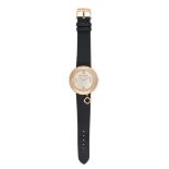 VAN CLEEF & ARPELS, A DIAMOND CHARM WATCH in 18ct yellow gold, the round watch face in a border o...