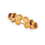 A CITRINE ETERNITY BAND RING in 14ct yellow gold, set with a row of round cabochon citrines, stam...