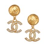 CHANEL, A PAIR OF VINTAGE DROP EARRINGS each with a textured clip suspending a CC logo set with c...