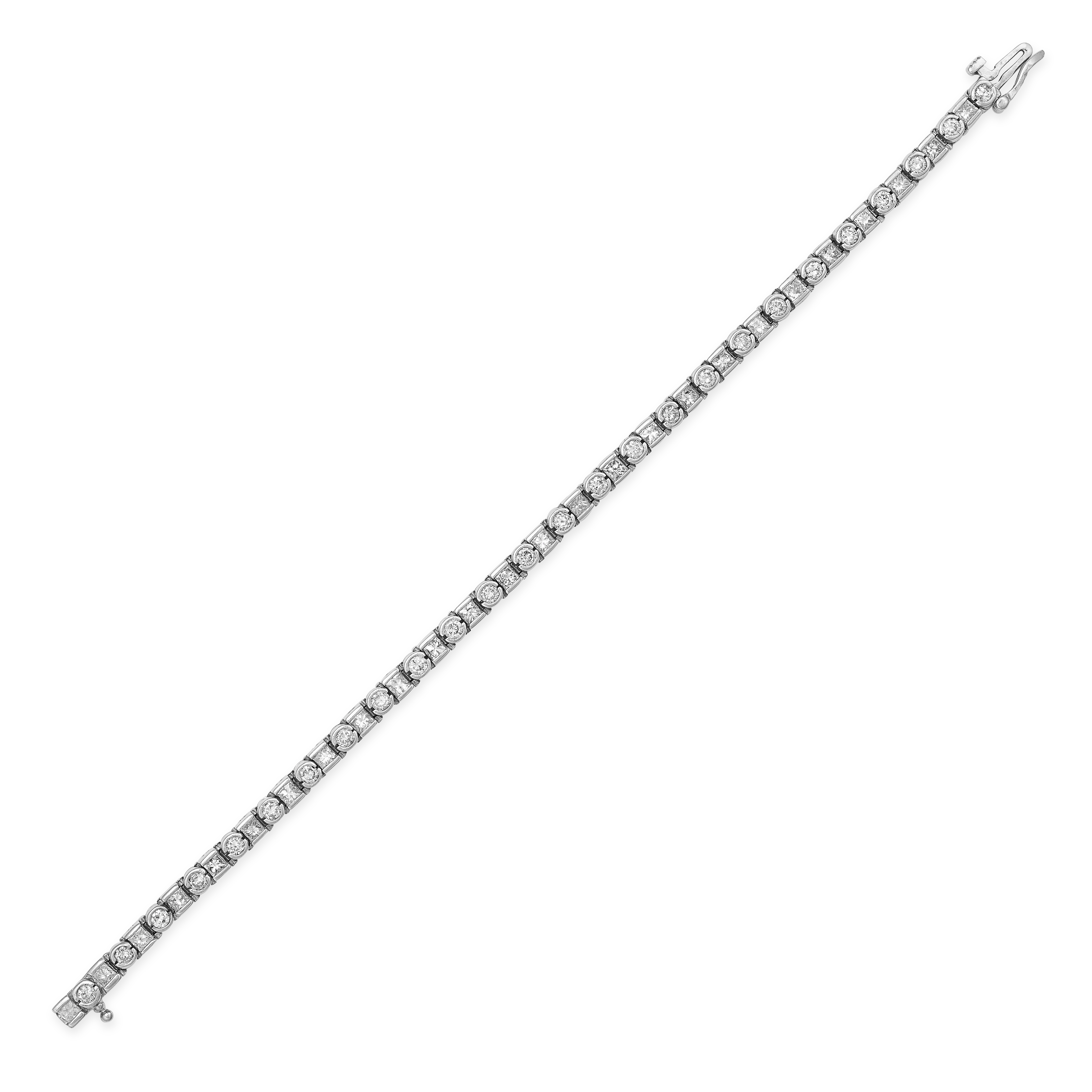 A DIAMOND LINE BRACELET in 14ct white gold, set with alternating princess and round brilliant cut...