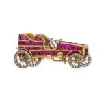 E VANDERHOVE, A RUBY AND DIAMOND CAR BROOCH, EARLY 20TH CENTURY in yellow gold and platinum, desi...