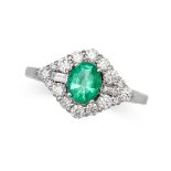 AN EMERALD AND DIAMOND RING in 18ct white gold, set with an oval cut emerald of 0.58 carats, agai...