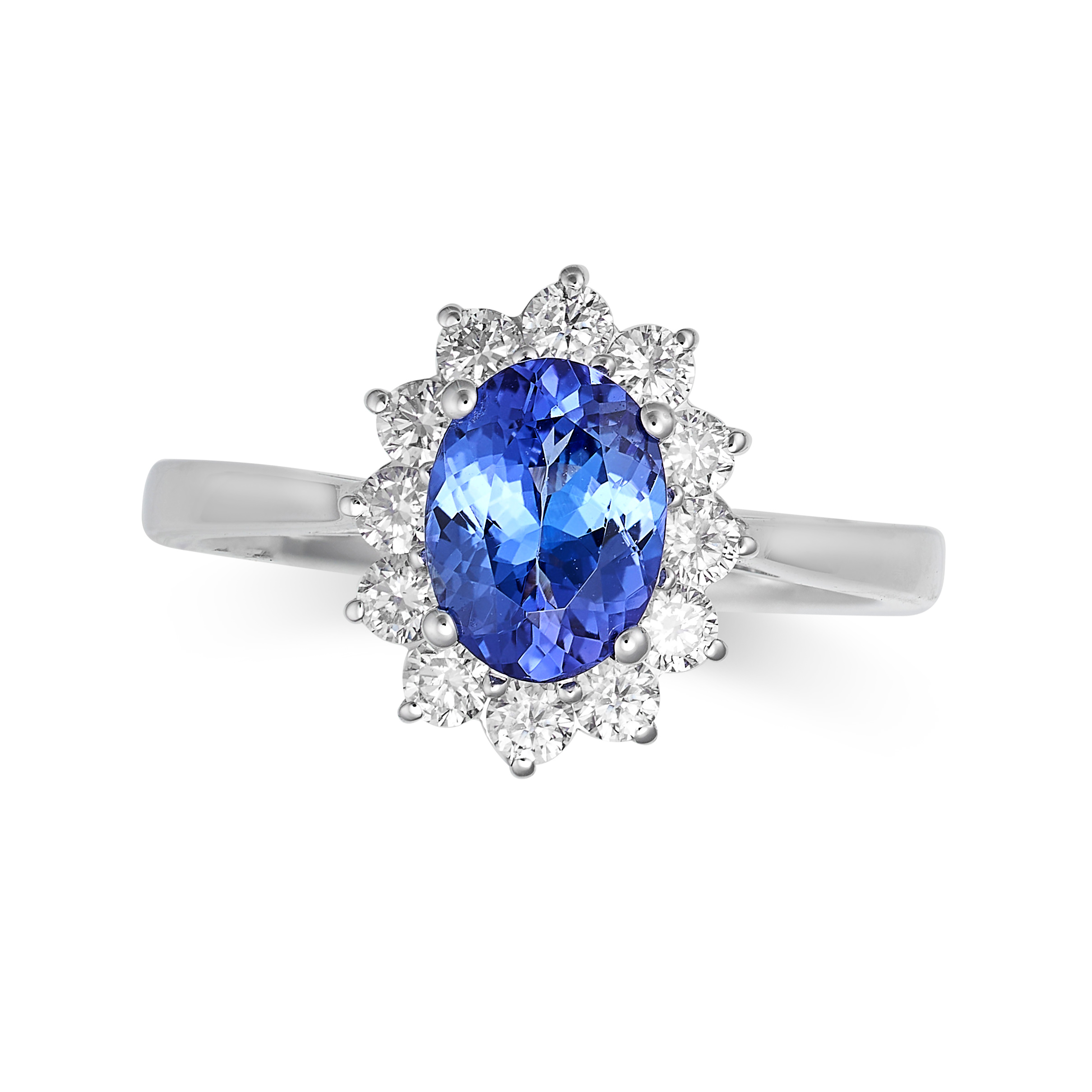 A TANZANITE AND DIAMOND CLUSTER RING in 18ct white gold, set with an oval cut tanzanite of 1.43 c...