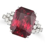 A GARNET AND DIAMOND RING in 18ct white gold, set with an octagonal mixed cut garnet of approxima...