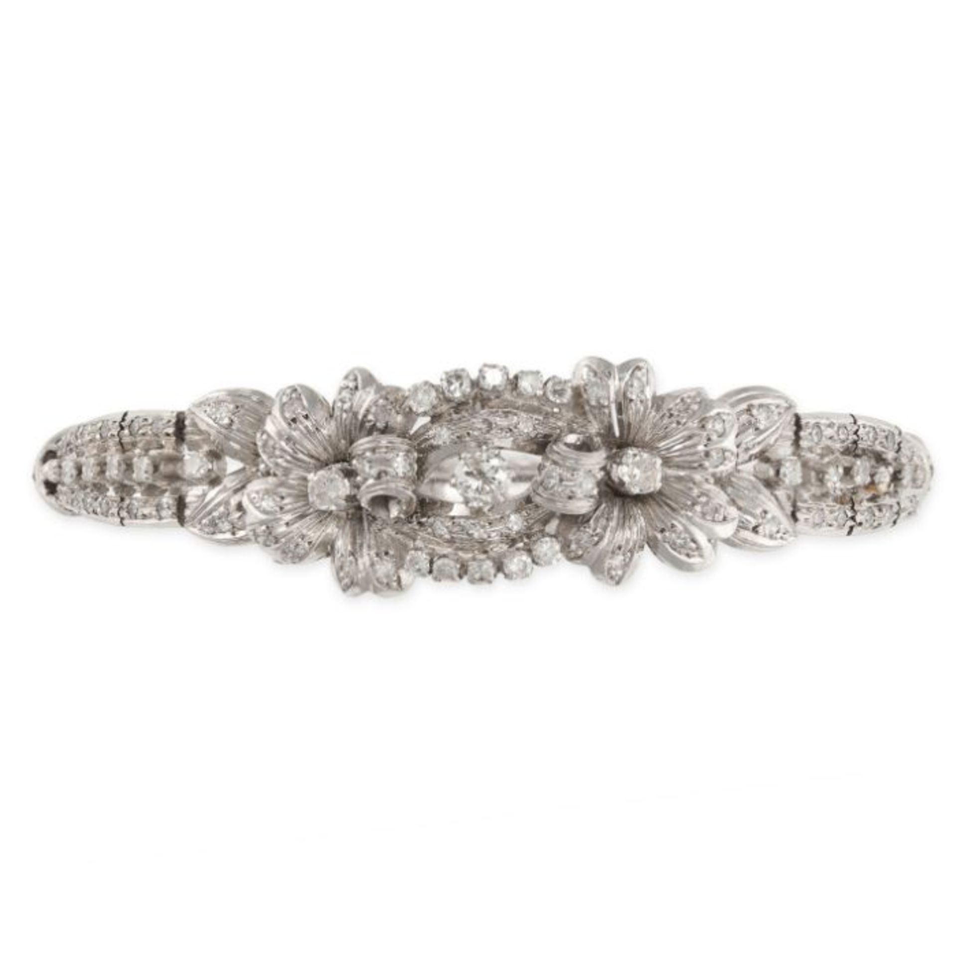 A VINTAGE DIAMOND BRACELET, 1950S in foliate design, set throughout with single and round brillia...