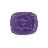A MODERN MOULDED GLASS SEAL cast from an intaglio, the cushion shaped moulded purple glass with the