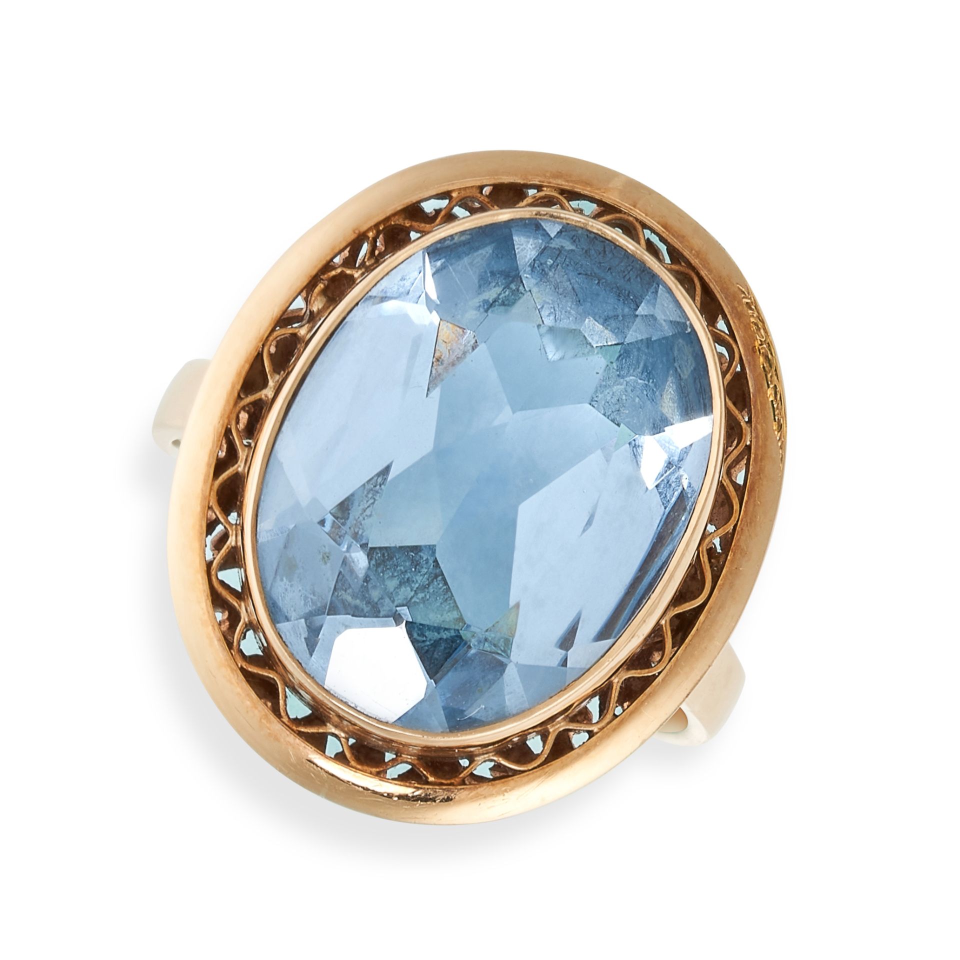 NO RESERVE - A SYNTHETIC BLUE SPINEL DRESS RING in yellow gold, set with an oval synthetic spinel...