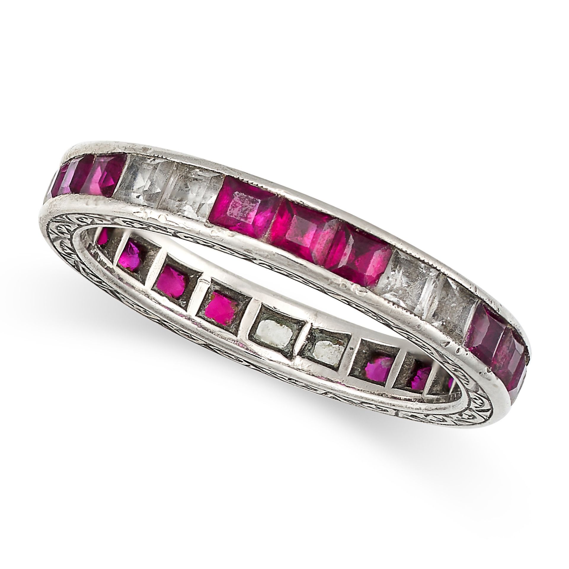 NO RESERVE - A SYNTHETIC RUBY AND WHITE GEMSTONE ETERNITY RING set all around with alternating tr...