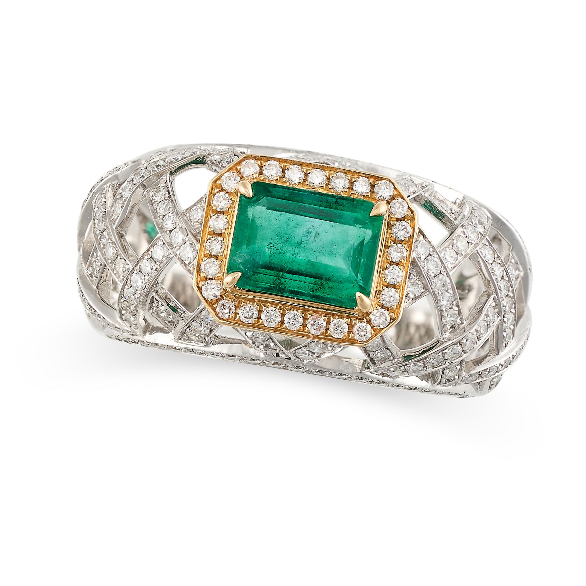 AN EMERALD AND DIAMOND DRESS RING in white and yellow gold, set with a step cut emerald of 1.28 c...