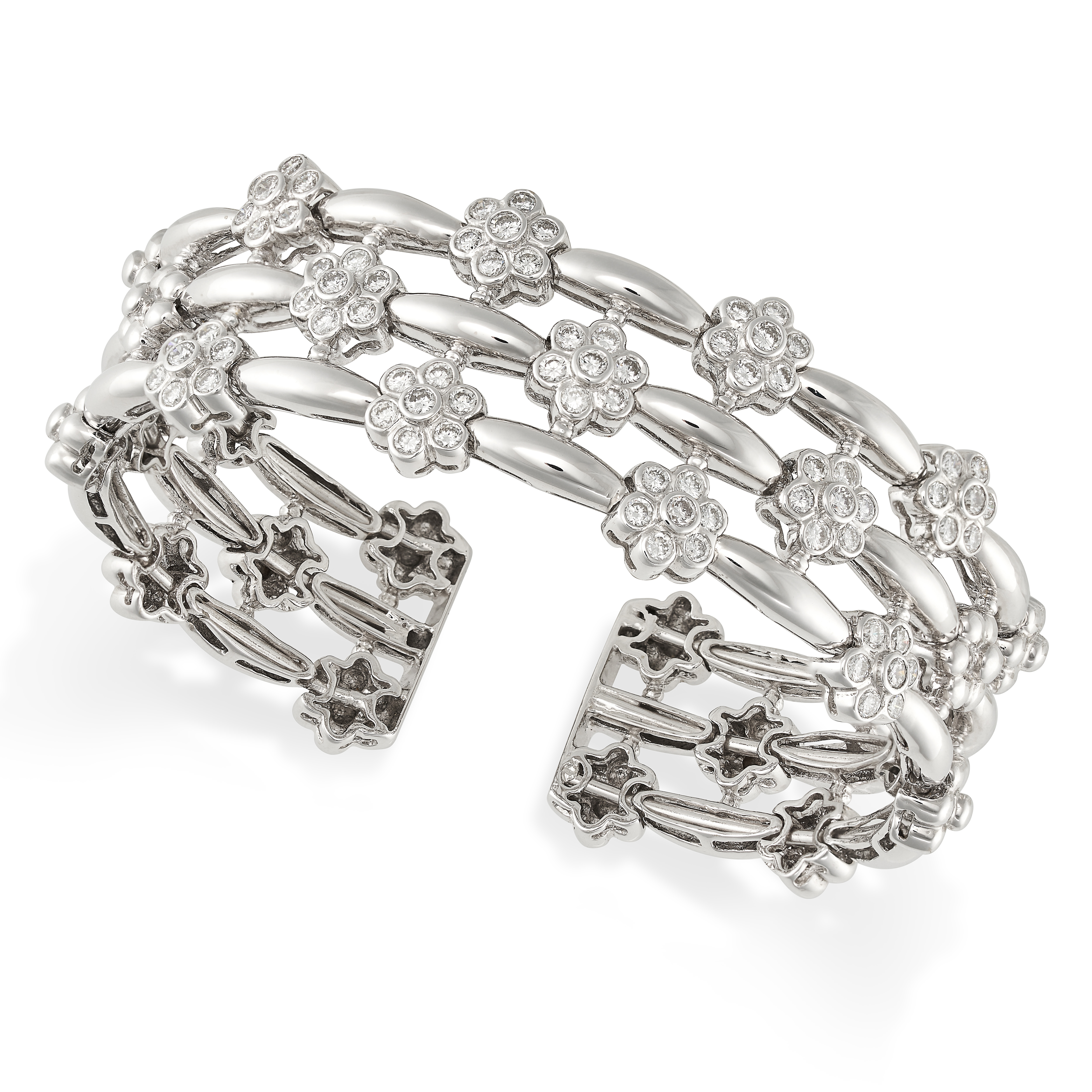 A DIAMOND CLUSTER BANGLE in 18ct white gold, comprising three rows set with staggered floral clus...