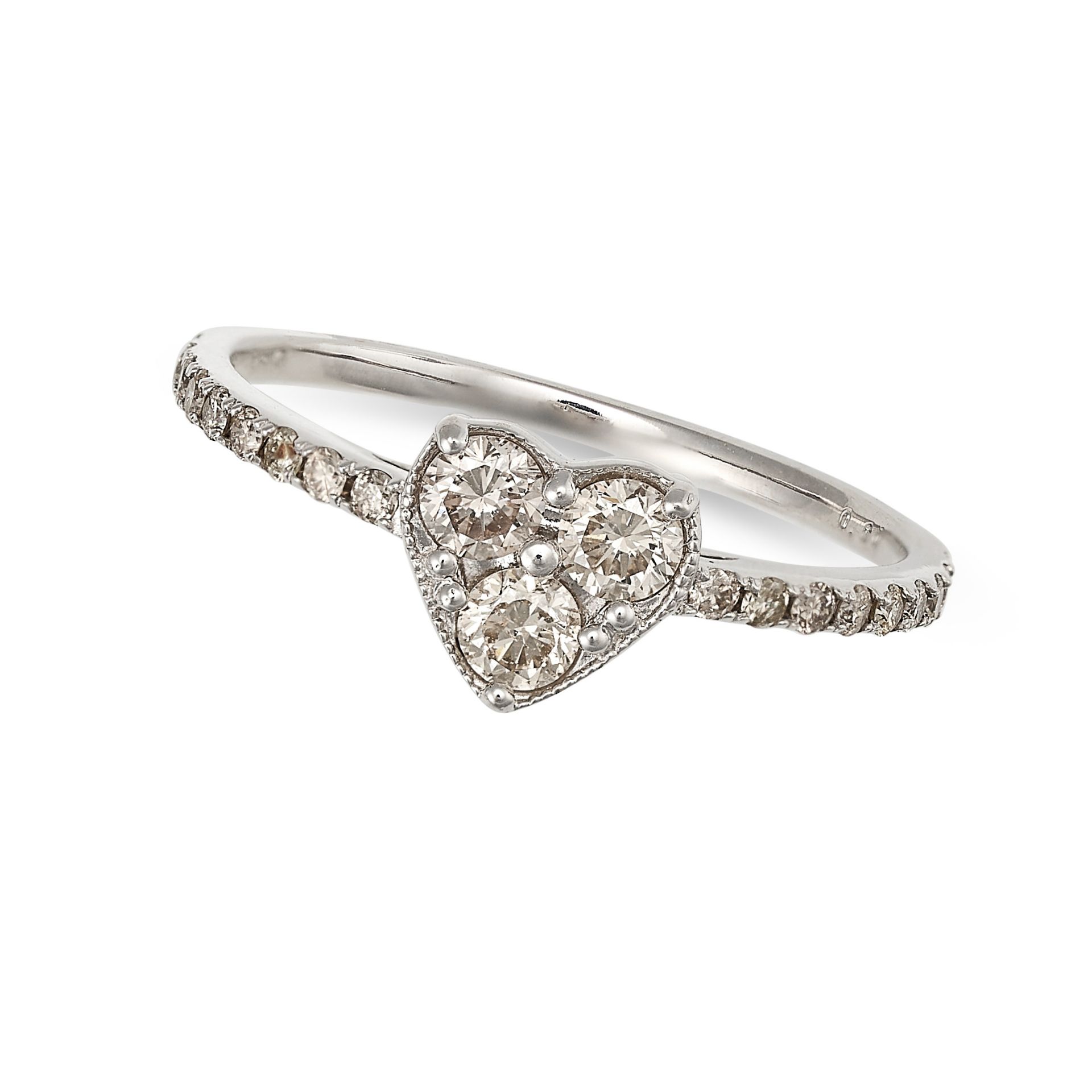 A DIAMOND HEART RING in 18ct white gold, the heart shaped face set with three round brilliant cut...