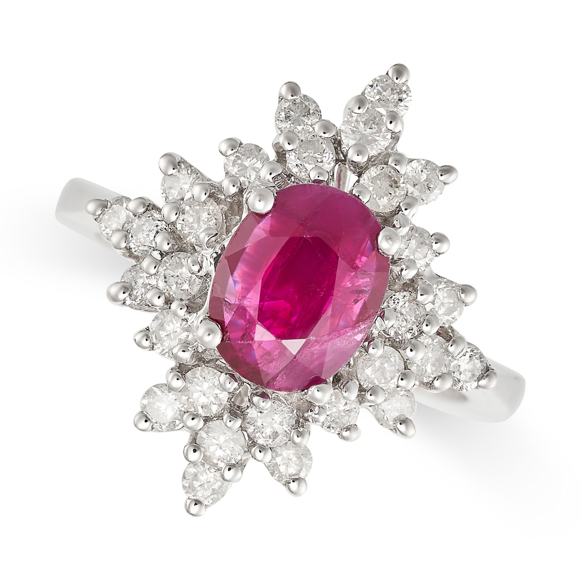 A RUBY AND DIAMOND CLUSTER RING in white gold, set with a cushion cut ruby of approximately 2.32 ...